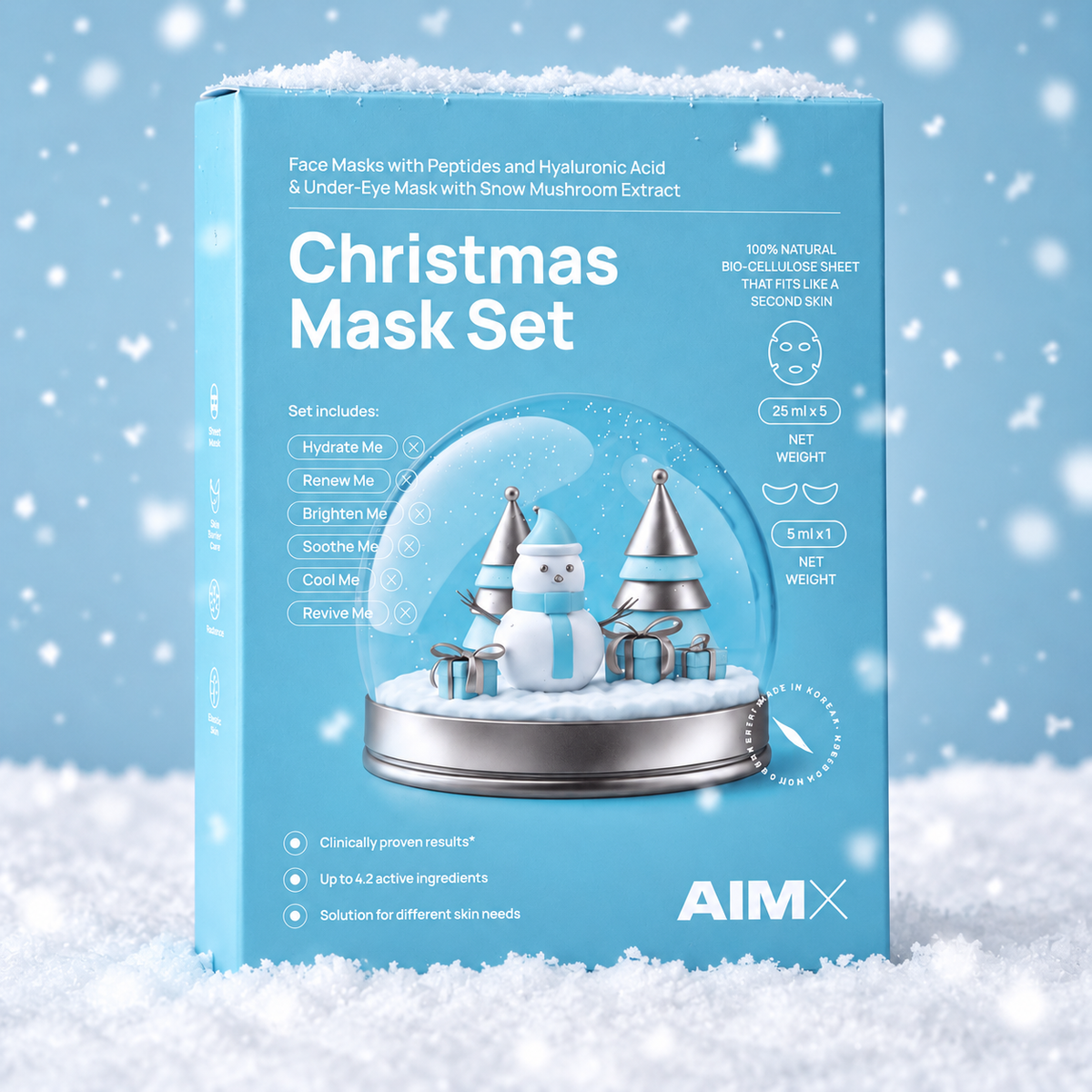 Close-up of the AIMX Christmas Mask Set box standing in snow, showing its snow-globe design and mask details.