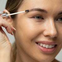 Lerelle Beauty Brows2Love eyebrow serum applied with spoolie wand to brow