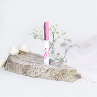 Lerelle Beauty Brows2Love eyebrow growth serum on stone with baby's breath flowers