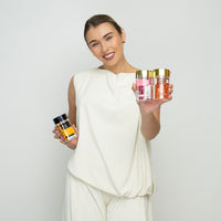 Lerelle Beauty founder holding jars of Ellips hair serum capsules