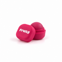 Lerelle Beauty Fruity cranberry lip balm in an open pink pot with the lid beside it