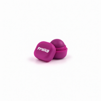 Lerelle Beauty Fruity grape lip balm in an open magenta pot with the lid beside it