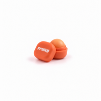 Lerelle Beauty Fruity peach lip balm in an open orange pot with the lid beside it
