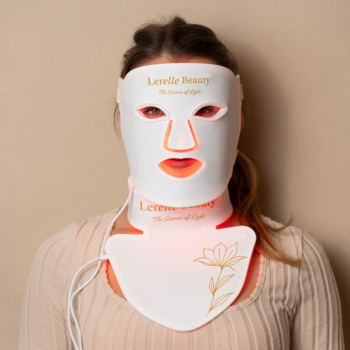 Lerelle Beauty LED light therapy face, neck and décolletage mask set worn in red light mode