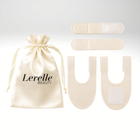 A set of cream led face and neck replacement straps , displayed next to a cream satin drawstring pouch printed with 'Lerelle BEAUTY' on a light gray background.