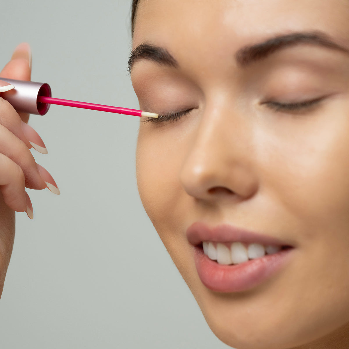 Lerelle Beauty Lashes2Love Biopeptides Lash Growth Serum applied to the lash line with the precision wand applicator